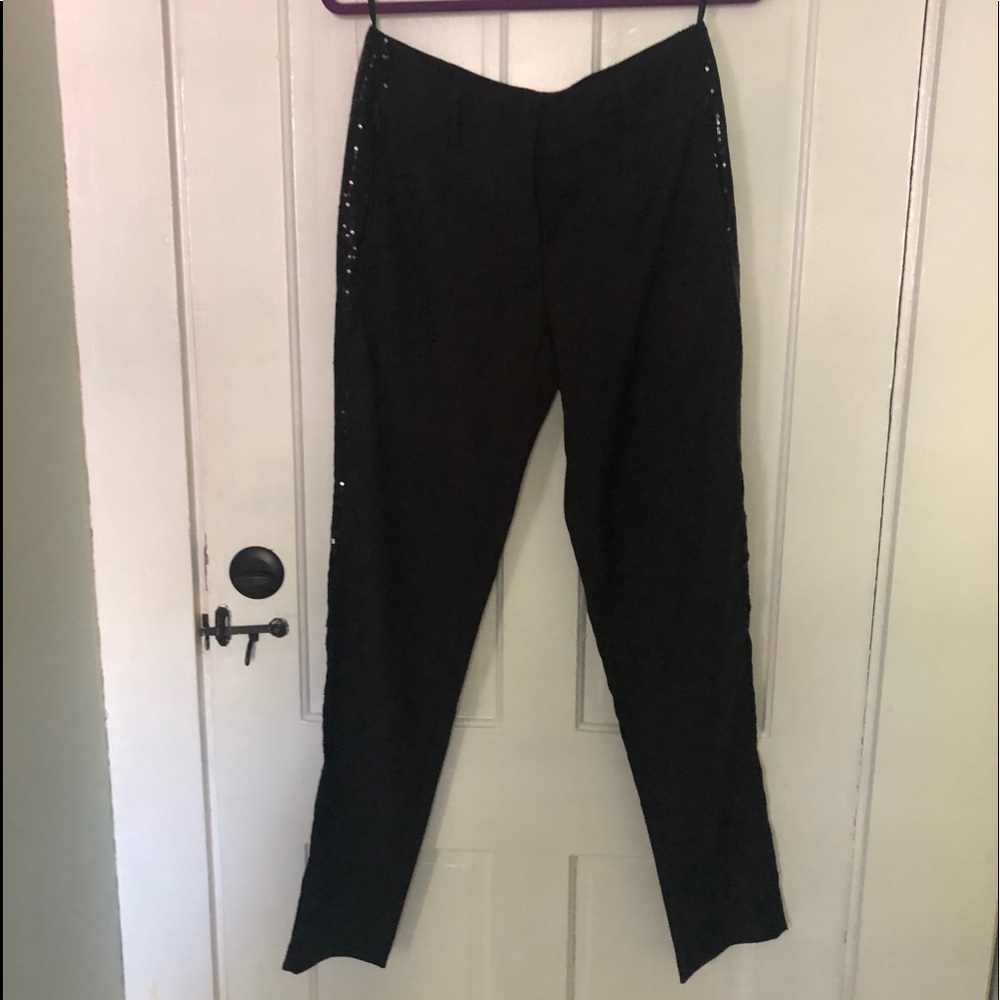 Pants tuxedo style with sequins on the side.